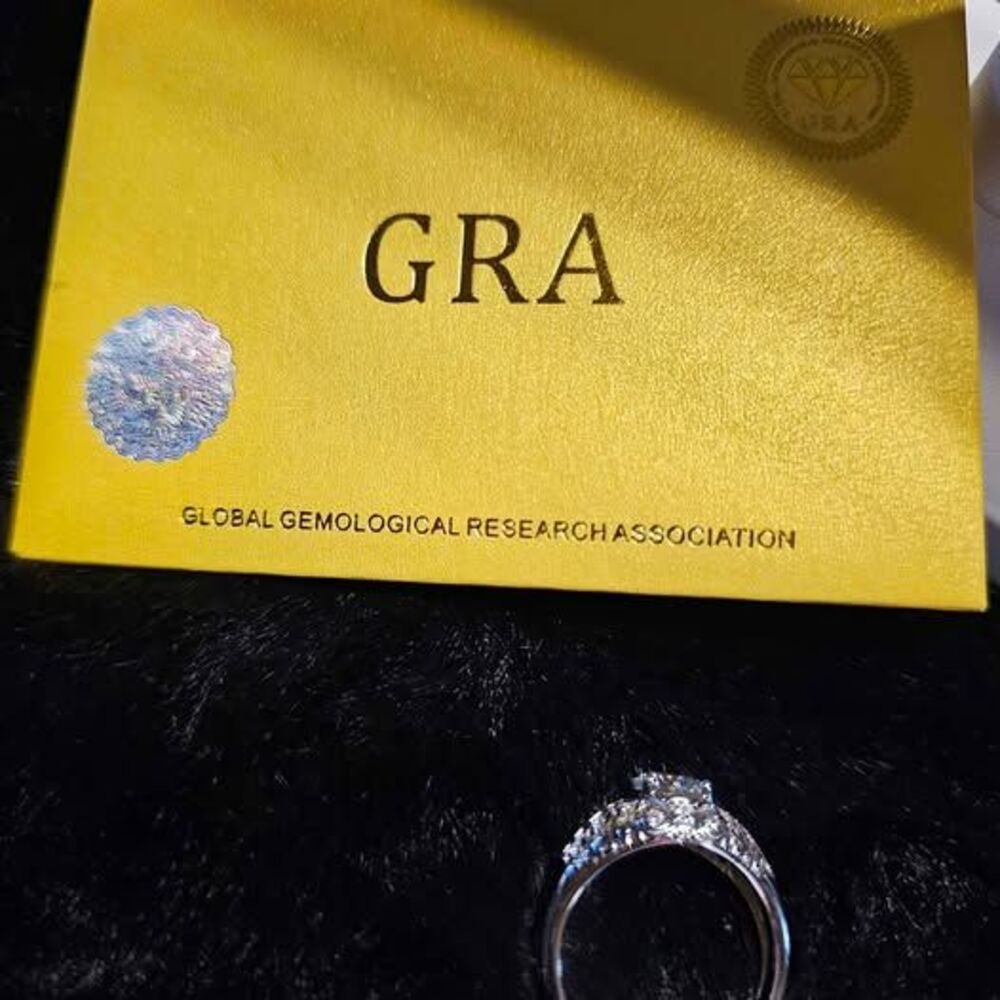 1CTW VVSD Moissanite Ring in 925 over, with pave accents. Size 9